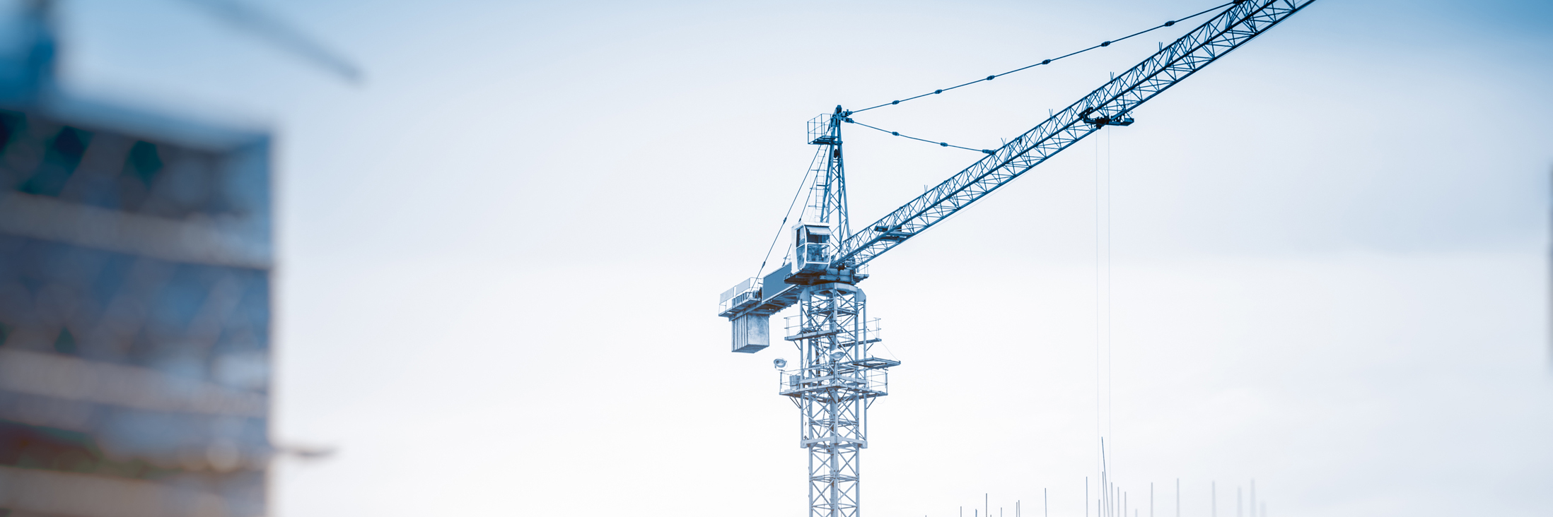 Low Angle View Of Cranes against skyline